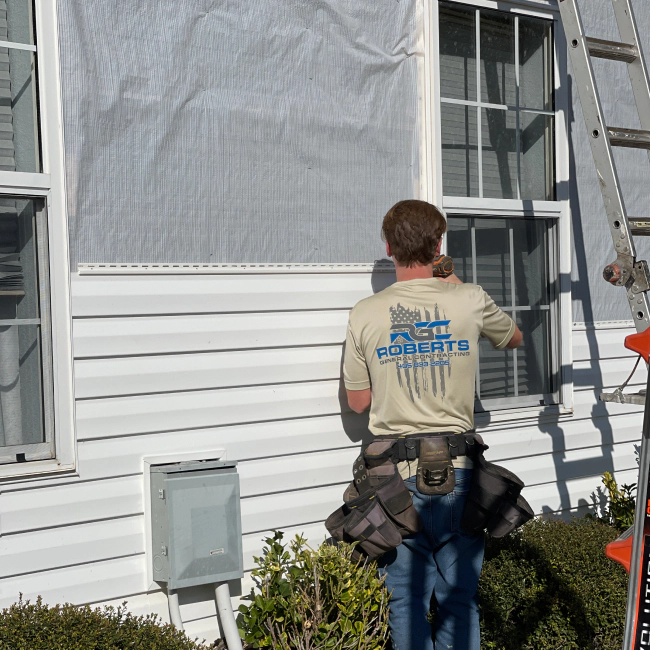 contractor installing white house siding noble ok